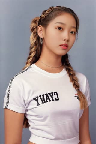 with braids wearing a white shirt with the word cyny written on it